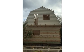Построенный дом из бруса под усадку