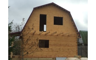 Построенный дом из бруса под усадку