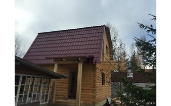 Построенный дом из бруса под усадку
